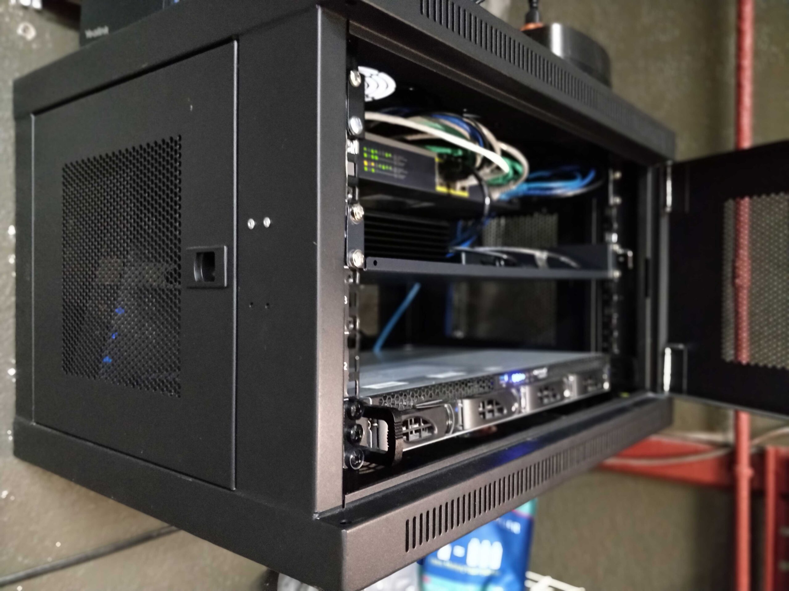 Wall mounted network rack with network equipment